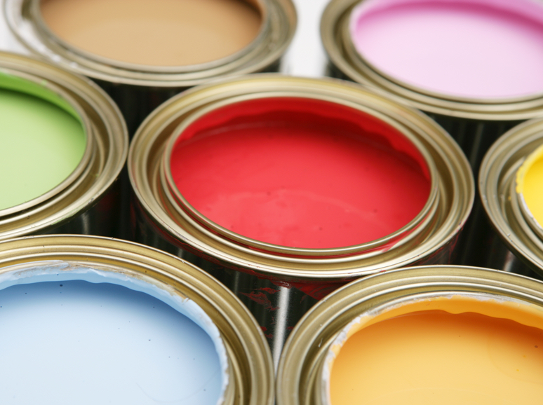 Open cans of colorful paint