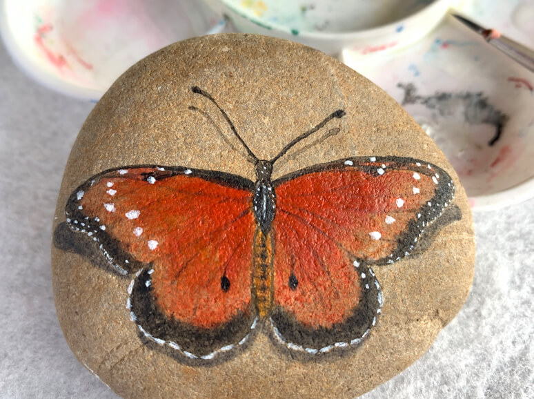 Painted butterfly on a stone